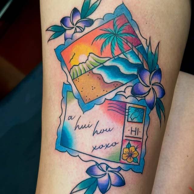 Colorful tropical postcard tattoo with flowers on upper arm